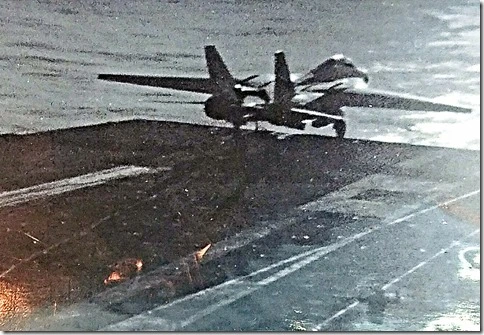 Split-second before David and pilot eject as F-14 goes over the side